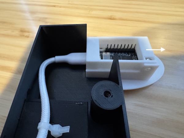 Sliding the screen holder to expose the hole